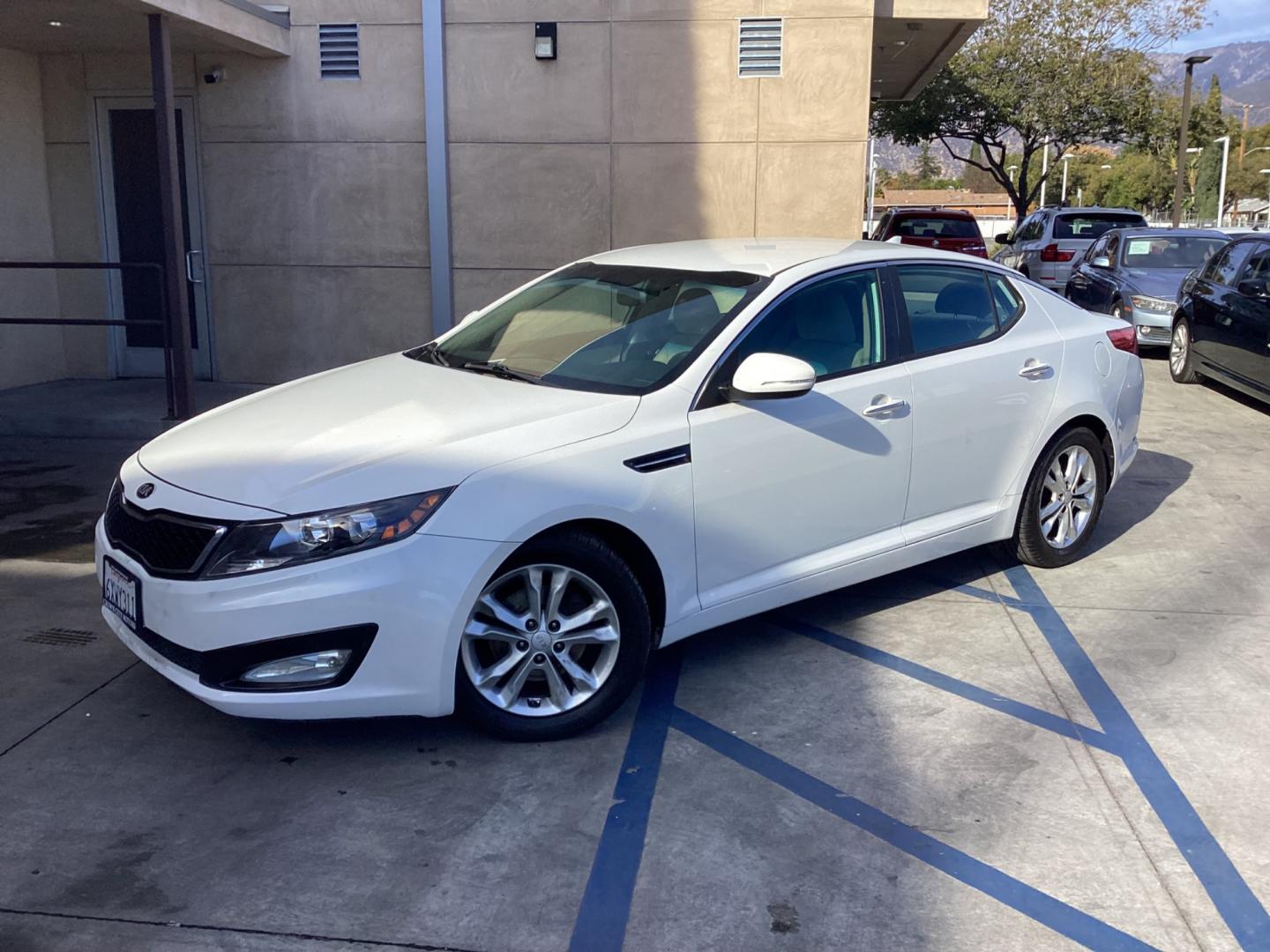 2013 WHITE Kia Optima (5XXGM4A72DG) , AUTOMATIC transmission, located at 30 S. Berkeley Avenue, Pasadena, CA, 91107, (626) 248-7567, 34.145447, -118.109398 - Crown City Motors is a used “Buy Here Pay Here” car dealer in Pasadena CA. “Buy Here Pay Here” financing, means that when you purchase your vehicle from our dealership, that you make the payments to the dealership as well. We do not need the banks approval to get you approved for a used auto - Photo#0